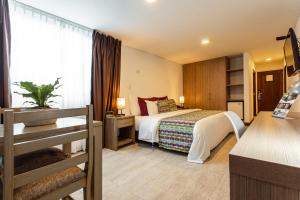 Postel nebo postele na pokoji v ubytování Hotel Carretero