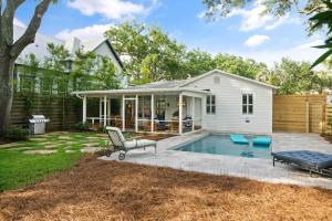 a backyard with a pool and a house at Endless Summer - 4217 - 6th Street in Saint Simons Island