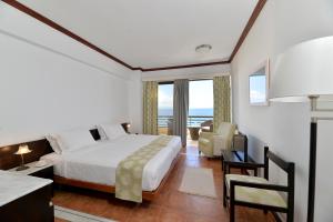 Postel nebo postele na pokoji v ubytování Limira Mare Hotel