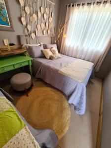 Cama ou camas em um quarto em Refúgio dos Coiotes
