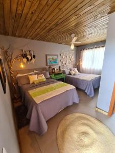 Cama ou camas em um quarto em Refúgio dos Coiotes