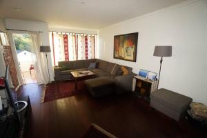a living room with a couch and a table at Apartement in Drammen close to the main city in Drammen