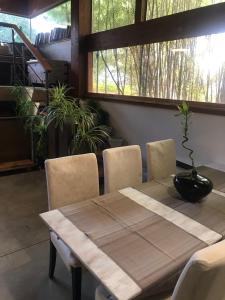 a dining room table and chairs with a table and a window at Villa Alba Boutique Hotel in Pescara