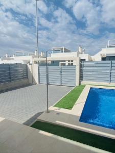 a swimming pool on the roof of a house at vistabella golf maui in Alicante
