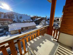 a balcony with a view of a snow covered mountain at Appartement Valberg in Valberg