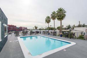 a swimming pool on the roof of a building at Executive Studio Jr One Bedroom with Balcony and Pool in Los Angeles