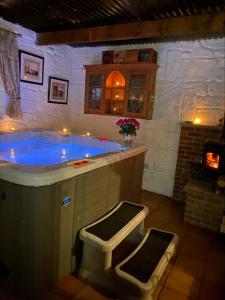 a large bathroom with a tub in a room at Nellie's Farmhouse in Carlingford