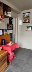 a room with a table with a red cloth on it at La vita e bella in Saint-Jean-Pied-de-Port