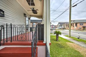 a house with a red porch with a fan at Central New Orleans Apt with Updated Interior in New Orleans