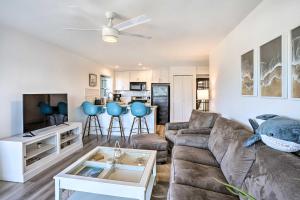 a living room with a couch and a table at San Clemente Condo with Gorgeous Views Near Beach! in San Clemente