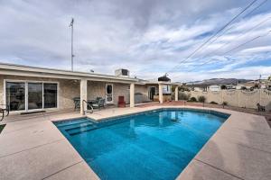 a swimming pool in the backyard of a house at Dog-Friendly Home with Pool in Lake Havasu City! in Lake Havasu City