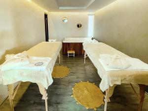Postel nebo postele na pokoji v ubytování Saint George Hotel - Spa & Temazcal