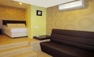 Postel nebo postele na pokoji v ubytování T-Hotel Bukit Bintang