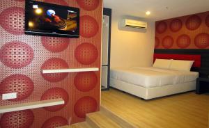 Postel nebo postele na pokoji v ubytování T-Hotel Bukit Bintang