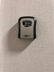 a remote control on the side of a wall at Apartment Home in NRW in Gladbeck