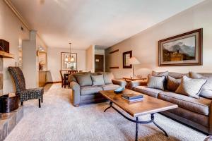 a living room with a couch and a table at PARK STATION 233 condo in Park City