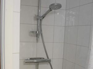 a shower with a shower head in a bathroom at 3 person holiday home in HAMMARÖ-By Traum in Hammarö +14 photos