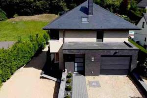 an aerial view of a house with a garage at VIP LOUNGE Appartement avec Jacuzzi et jardin in Andenne