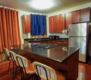 a kitchen with a counter top and a refrigerator at Rustic Sunset in New York