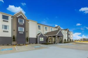 a rendering of the exterior of a apartment building at Red Roof Inn Sulphur in Sulphur