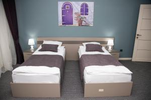 A bed or beds in a room at Casablanca Apart Hotel