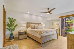 a bedroom with a bed and a ceiling fan at WAILEA ELUA, #1509 condo in Wailea
