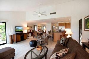 a living room with a couch and a table at Wailea Elua, #0908 condo in Wailea