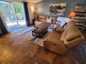 a living room with a couch and a table at Misty Valley Inn in Forks