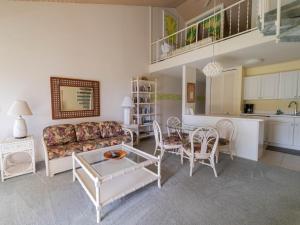 a living room with a couch and a table at Turtle Bay Sea BreezeNUC 90-TVU-0498 in Kahuku