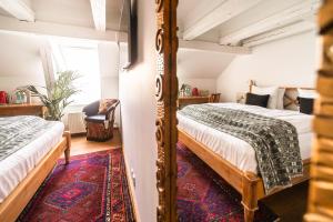 Cama o camas de una habitación en Babette Guldsmeden