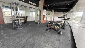a gym with a bike parked in a room at AEON Towers Davao in Davao City