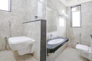 two pictures of a bathroom with a toilet and a sink at FabExpress Rudra Residency - Nr Medicover hospital in Chinchiwad +20 photos