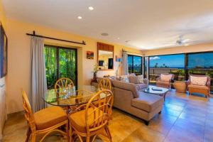 a living room with a couch and a table and chairs at WAILEA ELUA, #0307 condo in Wailea