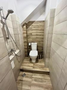 a small bathroom with a toilet and a sink at Studio Thermi 1 in Varna City