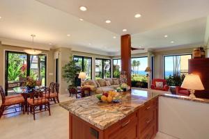 a kitchen and living room with a island with fruit on it at WAILEA ELUA, #1403 condo in Wailea