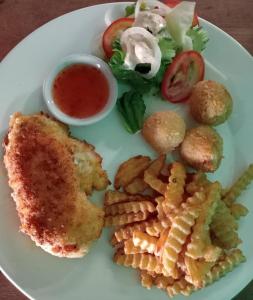 a plate of food with chicken and fries and a salad at White Pearl Beach in Kaôh Rŭng (3)