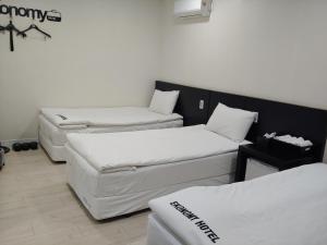 a room with three mattresses at Korea guesthouse in Gumi