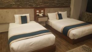 Voodi või voodid majutusasutuse River Nile Edge Boutique Hotel & Restaurant toas