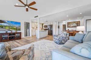 a living room with a couch and a ceiling fan at WAILEA ELUA, #0702 condo in Wailea