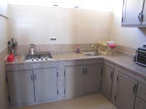 a kitchen with a sink and a counter top at Taghazout Waves 1 in Taghazout