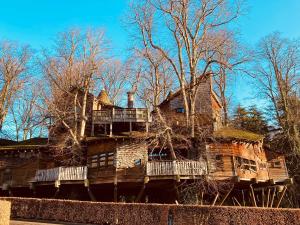 a large wooden house with balconies on top of it at 20 Lisburn Street in Alnwick