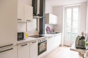 A cozinha ou cozinha compacta de Bail mobilité- Charmant T2 proche de Castellane