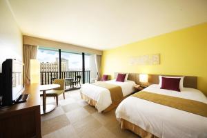 Postel nebo postele na pokoji v ubytování Guam Reef Hotel