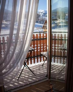 a view from a window of a balcony at Zwijaczówka in Zakopane