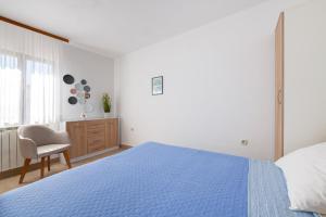 Postel nebo postele na pokoji v ubytování VILLA LIVIA with three nice apartments, swimming pool, childrens playground, barbecue and free parking