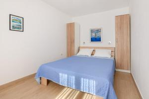 Postel nebo postele na pokoji v ubytování VILLA LIVIA with three nice apartments, swimming pool, childrens playground, barbecue and free parking