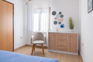 Postel nebo postele na pokoji v ubytování VILLA LIVIA with three nice apartments, swimming pool, childrens playground, barbecue and free parking