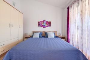 Postel nebo postele na pokoji v ubytování VILLA LIVIA with three nice apartments, swimming pool, childrens playground, barbecue and free parking