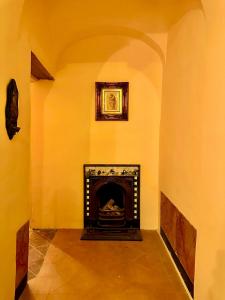 a room with a fireplace with a picture on the wall at Casa Santangelo Suites in Salerno
