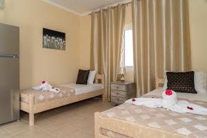 A bed or beds in a room at Chrispa's House